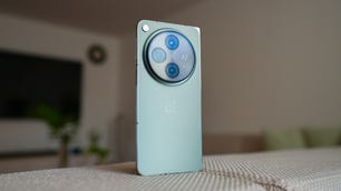 OnePlus Open folded open on energy yellow background